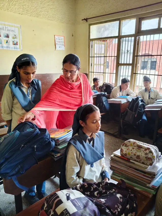 Teachers supporting pupils during classroom learning